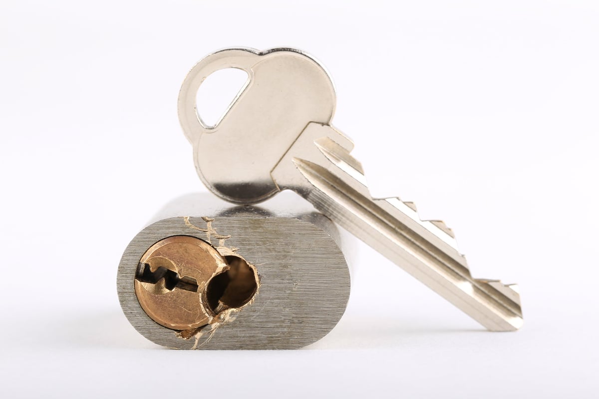 Brass key in metal lock cylinder
