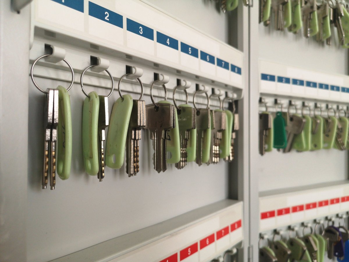 Key hanging inside a metal key cabinet
