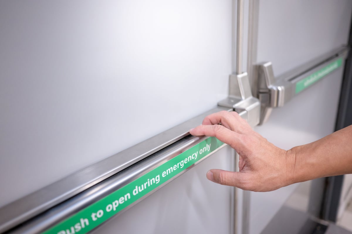 Stainless steel panic bar on emergency fire exit door
