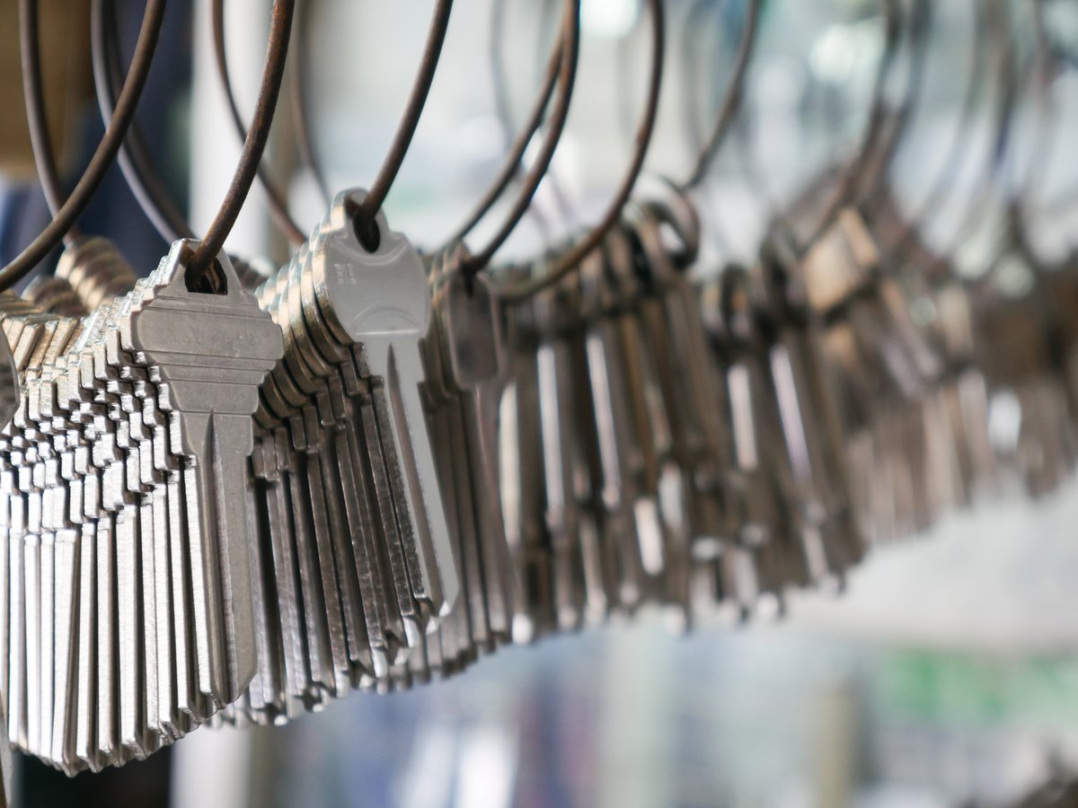 Multiple keys hanging on wire rings at locksmith shop